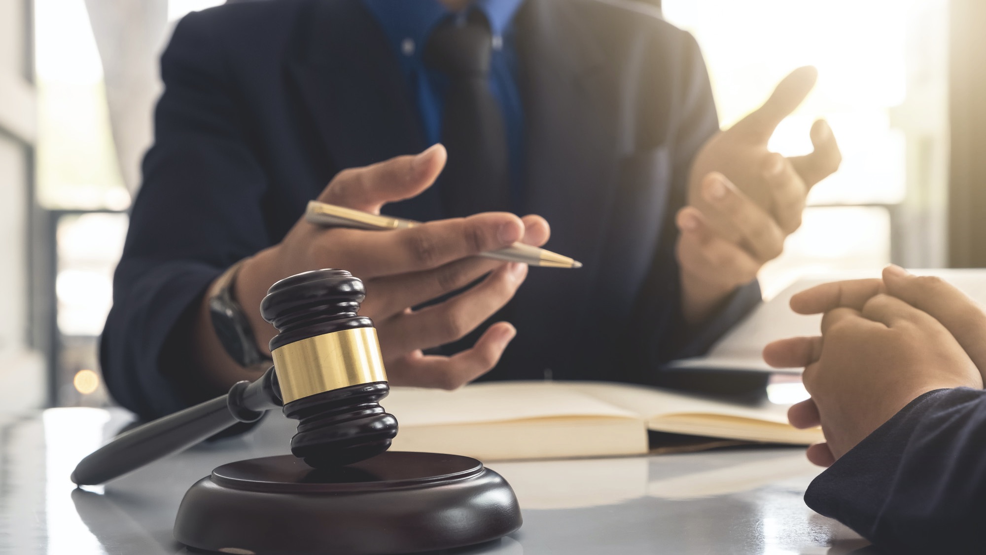 Business lawyer working about legal legislation in courtroom to help their customer